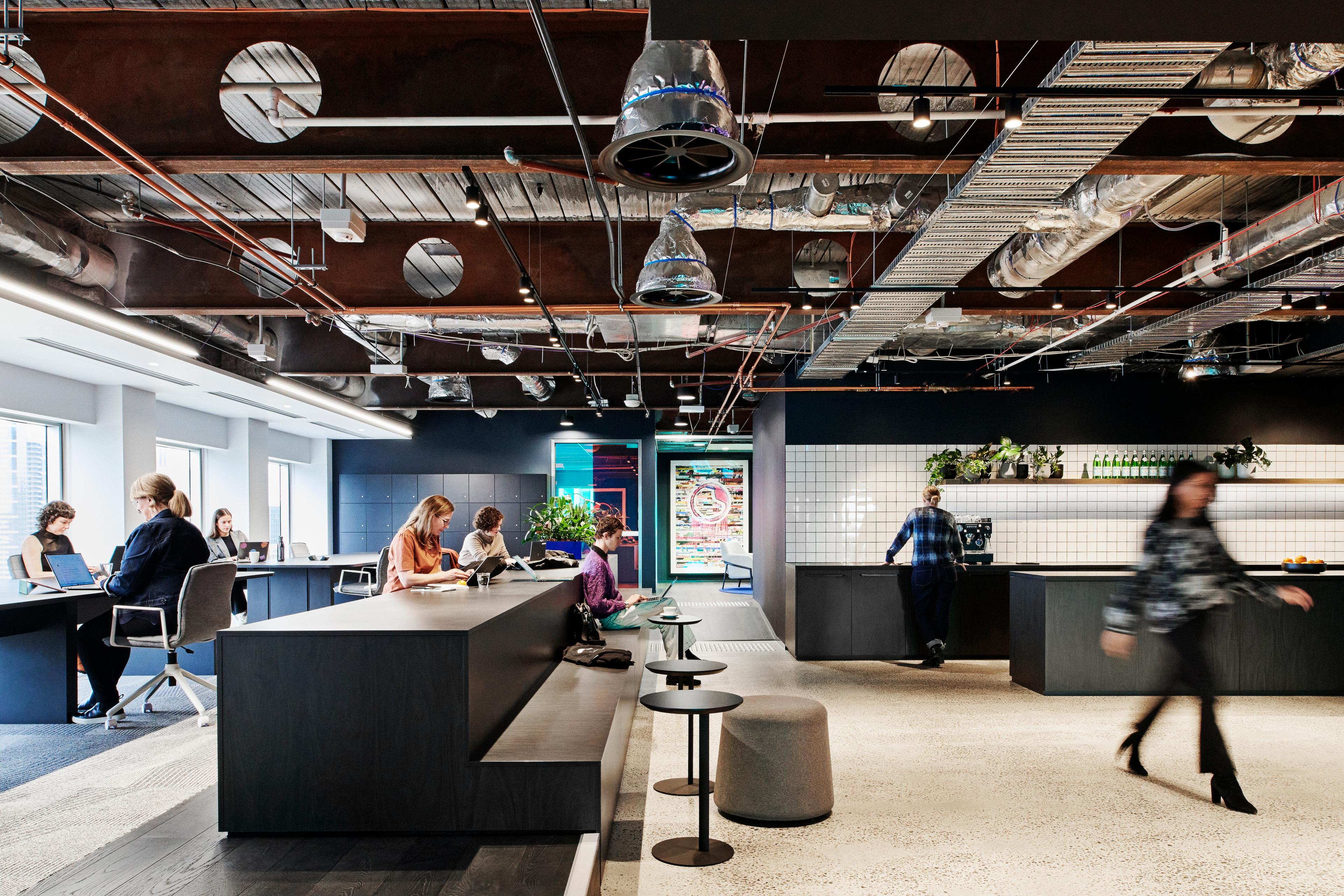 Open work space with kitchen and natural light.