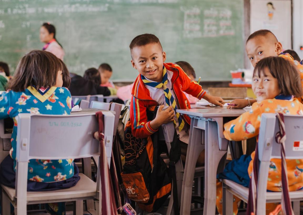 Smiling group of children in a classroom