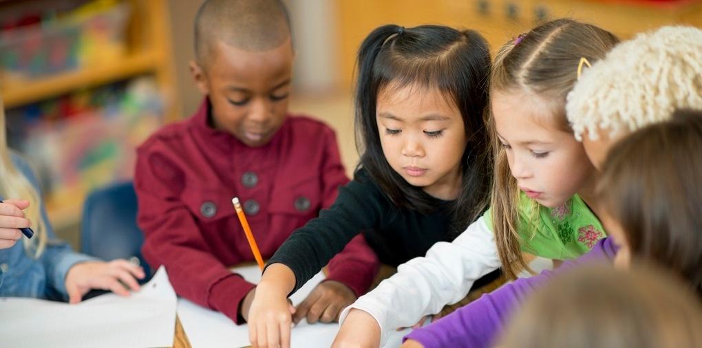 A multicultural group of children in a classroom setting