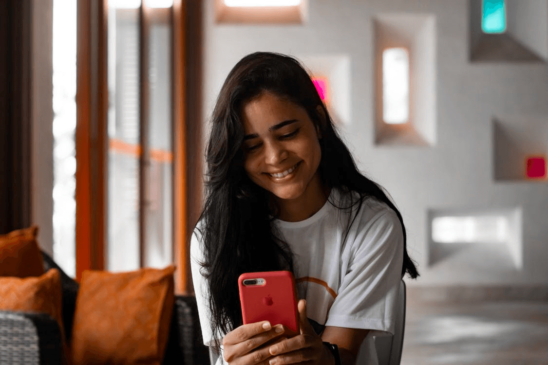 Young person checking messages on phone